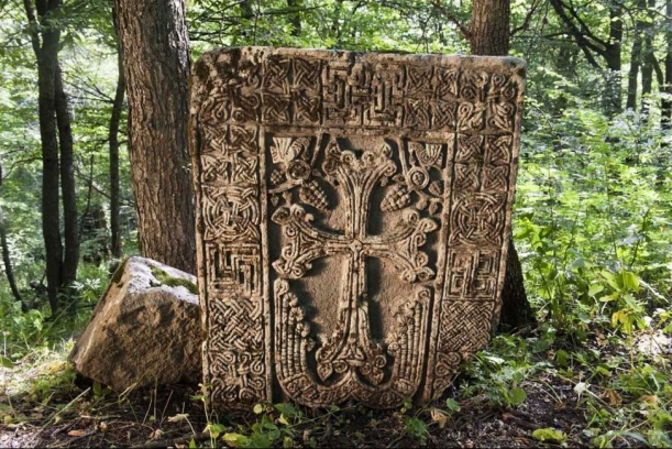 Medieval Armenian khachkar (Cross-stone) in the forest near the town of Lachin