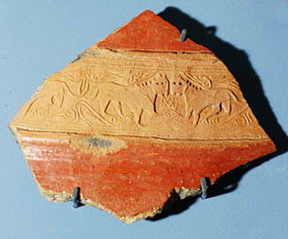 Fragment of a stamped karas-vessel band with lion images10th-11th cc., Dvin, clay