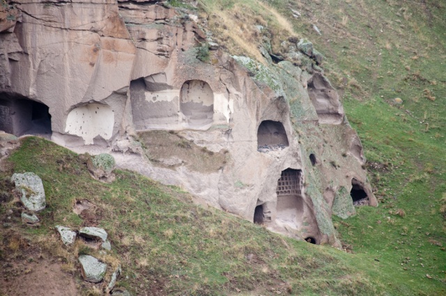 Ancient rock-carved village in Ani. Erosion over the centuries have exposed home interiors.